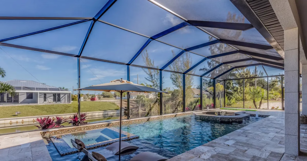 Professional pool enclosure cleaning and screen washing in Kissimmee FL by PatioShield, removing algae, dirt, and mildew for spotless enclosures