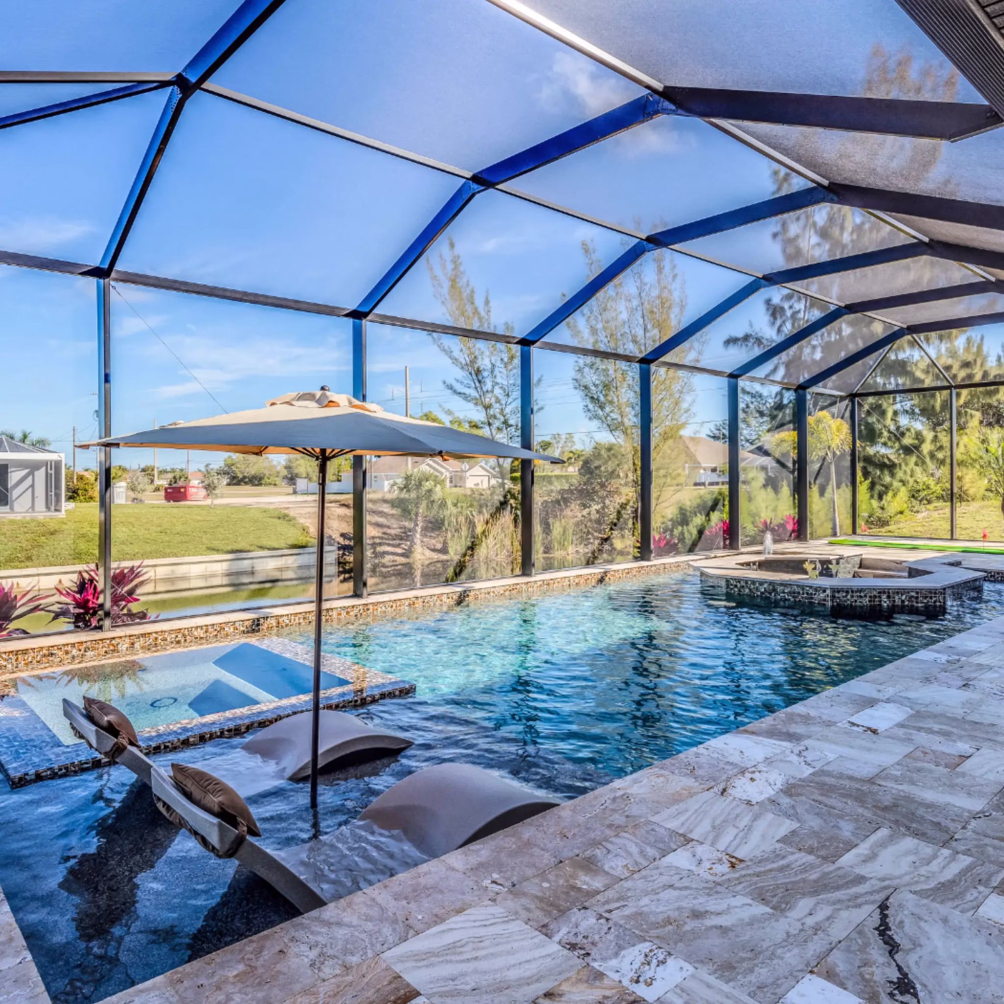 Professional pool enclosure cleaning in Kissimmee FL by PatioShield, removing dirt, algae, and debris for a spotless and safe pool area