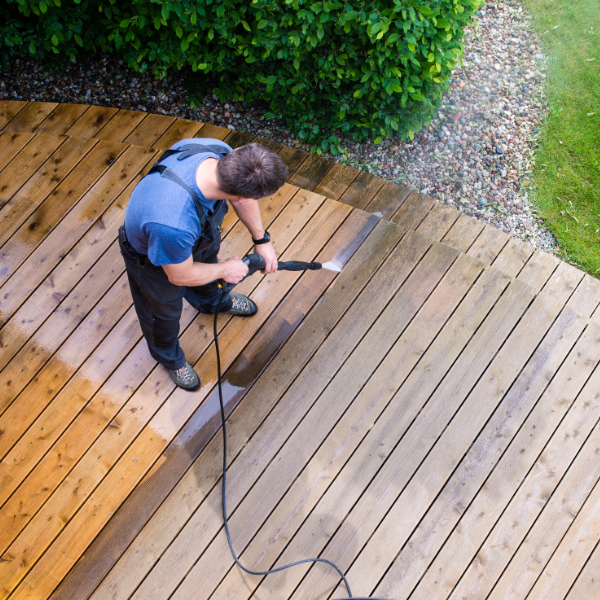 Professional deck pressure washing by PatioShield, removing dirt, mildew, and stains to restore the natural beauty of outdoor decks