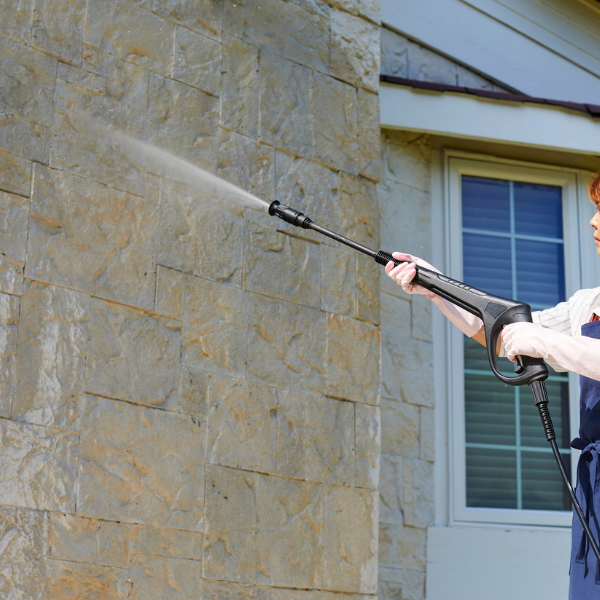 Professional wall cleaning with pressure washing by PatioShield, removing dirt, mold, and stains from exterior surfaces for a refreshed look